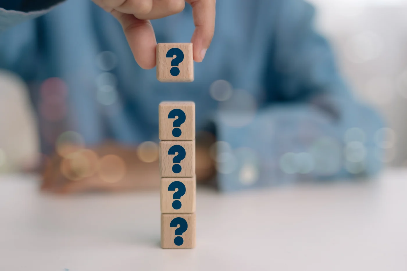 Company FAQs | Austin, TX Roof Replacement | Willi Roofing Services A collection of blocks with question marks on each block
