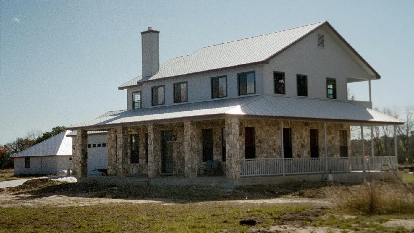 Outstanding Roofing Contractor Austin Tx Willi Roofing A two-story home in Travis County with a new metal roof installed by Willi Roofing
