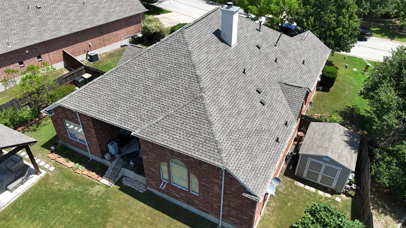 Mike V Roof Replacement Austin Area Willi Roofing Services An overhead, drone’s-eye view of the newly replaced roof on Mike. V’s Austin area home.
