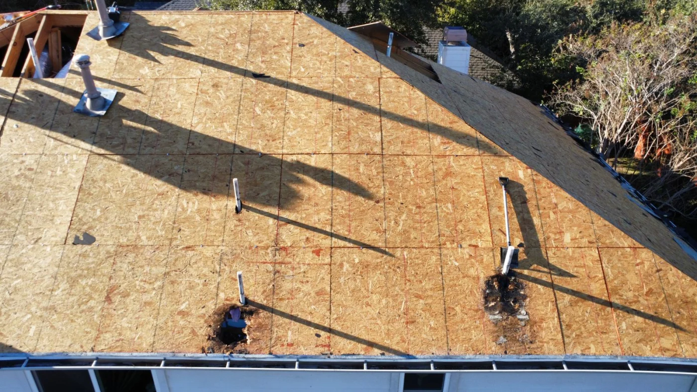 An aerial view of a roofing deck during a roofing tear-off during a roof replacement in Buda, TX.