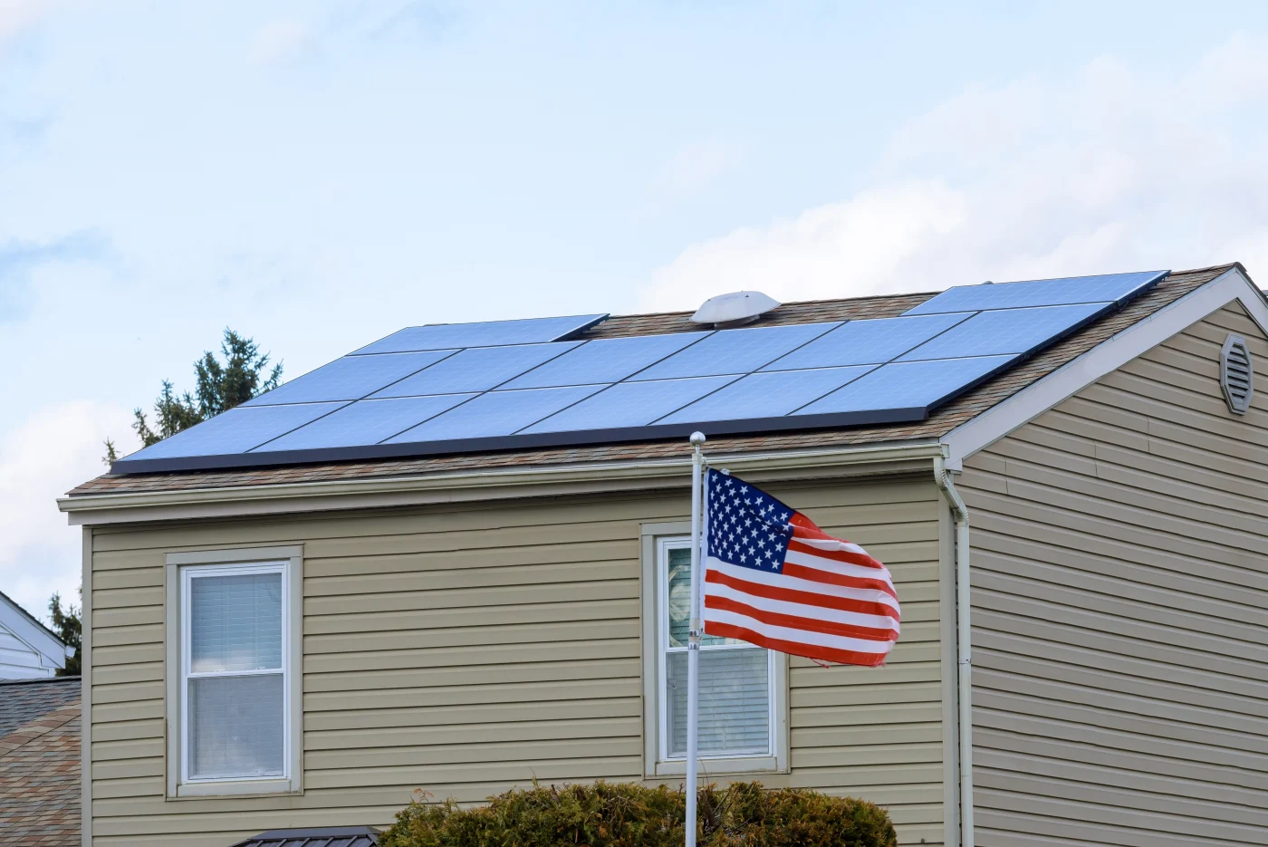 Solar panel array installed on a green asphalt shingle roof in Lakeway, TX, showcasing clean solar roofing integration on a residential home