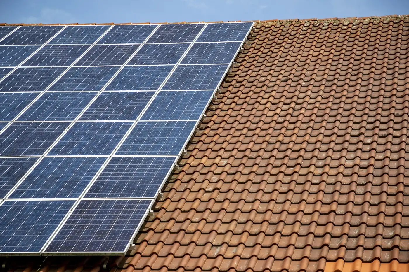 Solar panels on a tile roof.