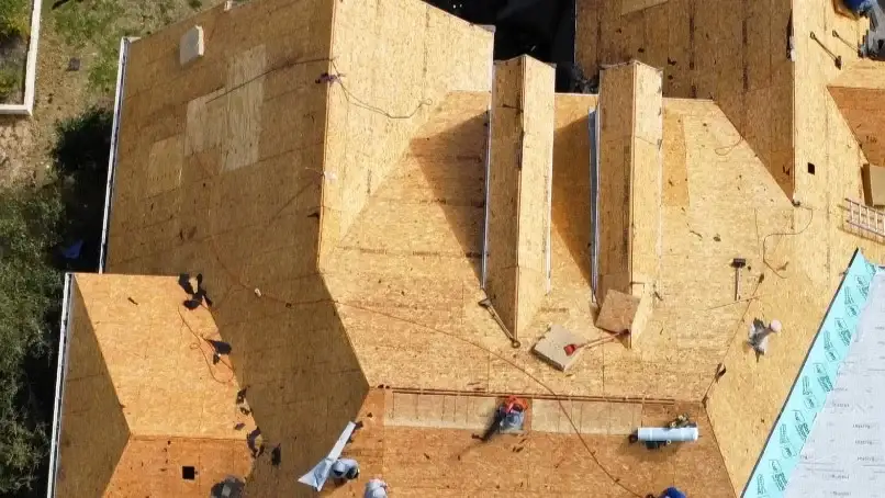 A tear-off of old roof materials during a roof replacement.